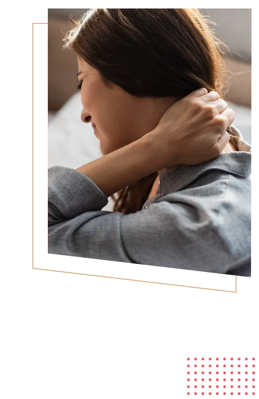 Person holding back of neck in discomfort